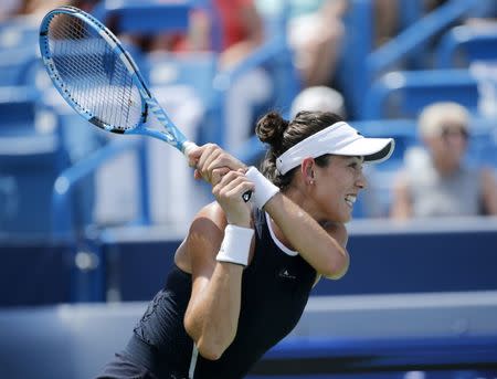 Aug 20, 2017; Mason, OH, USA; Garbine Muguruza returns a shot in the first set of the womens finals match against Simona Halep during the Western & Southern Open at the Lindner Family Tennis Center. Mandatory Credit: Sam Greene/The Cincinnati Enquirer via USA TODAY NETWORK