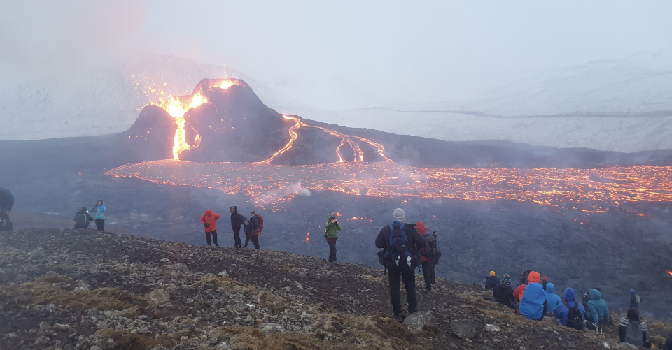 Wikipedia/CC By 4.0/Berserkur - Own work:  People on the slopes of Fagradalsfjall, watching the Geldingadalir eruption. Link: https://en.wikipedia.org/wiki/Fagradalsfjall#/media/File:Geldingadalagos2.jpg