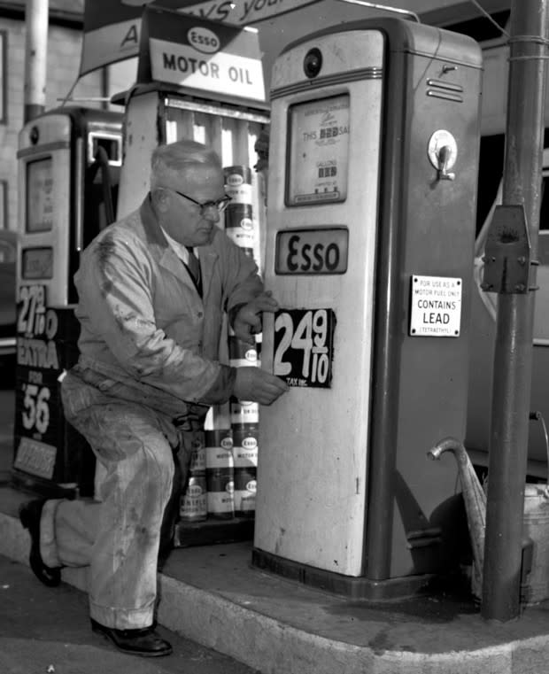 Clifford F. Lord posts a price for leaded gasoline at<br> his station in Everett, Massachusetts in 1955. (AP / CityLab)