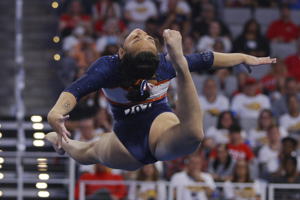 Auburn's Sunisa Lee competes in the floor exercise during the NCAA college women's gymnastics championships, Saturday, April 16, 2022, in Fort Worth, Texas. (AP Photo/Gareth Patterson)