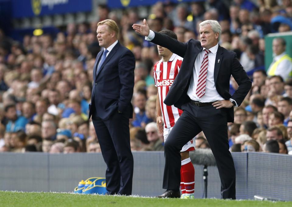 Football Soccer Britain - Everton v Stoke City - Premier League - Goodison Park - 27/8/16 Stoke City manager Mark Hughes and Everton manager Ronald Koeman Action Images via Reuters / Ed Sykes Livepic EDITORIAL USE ONLY. No use with unauthorized audio, video, data, fixture lists, club/league logos or "live" services. Online in-match use limited to 45 images, no video emulation. No use in betting, games or single club/league/player publications. Please contact your account representative for further details.