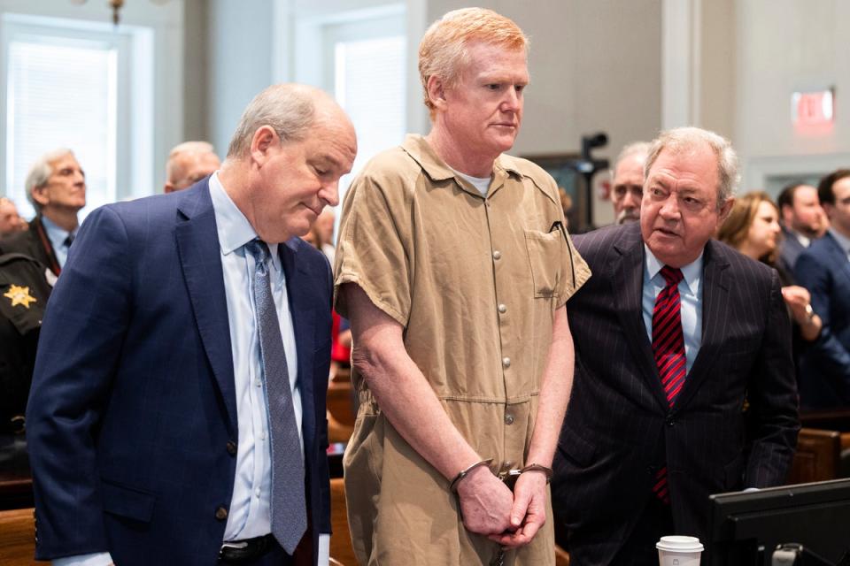 Alex Murdaugh speaks with his legal team before he is sentenced to two consecutive life sentences for the murder of his wife and son