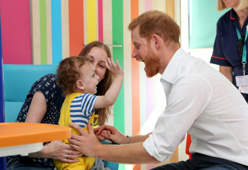 The Duke of Sussex plays with one year old Noah Nicholson during his visit to Sheffield Children's Hospital in Clarkson Street, Sheffield, where he officially opened the new wing.