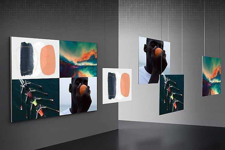 Samsung microLED TVs on a wall showing the 4Vue feature with four pieces of art on screen.