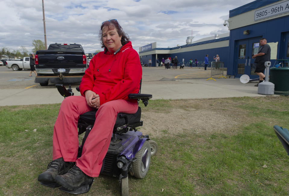 <p>Kristen Leer, a Fort Nelson, B.C. evacuee, stops for a photo at the North Peace Arena in Fort St. John, B.C., on Monday, May 13, 2024. Leer said as a quadriplegic she is impressed with how the province is treating people with disabilities. Wildfires are forcing more people to evacuate their homes in dry and windy northeastern B.C.</p> 