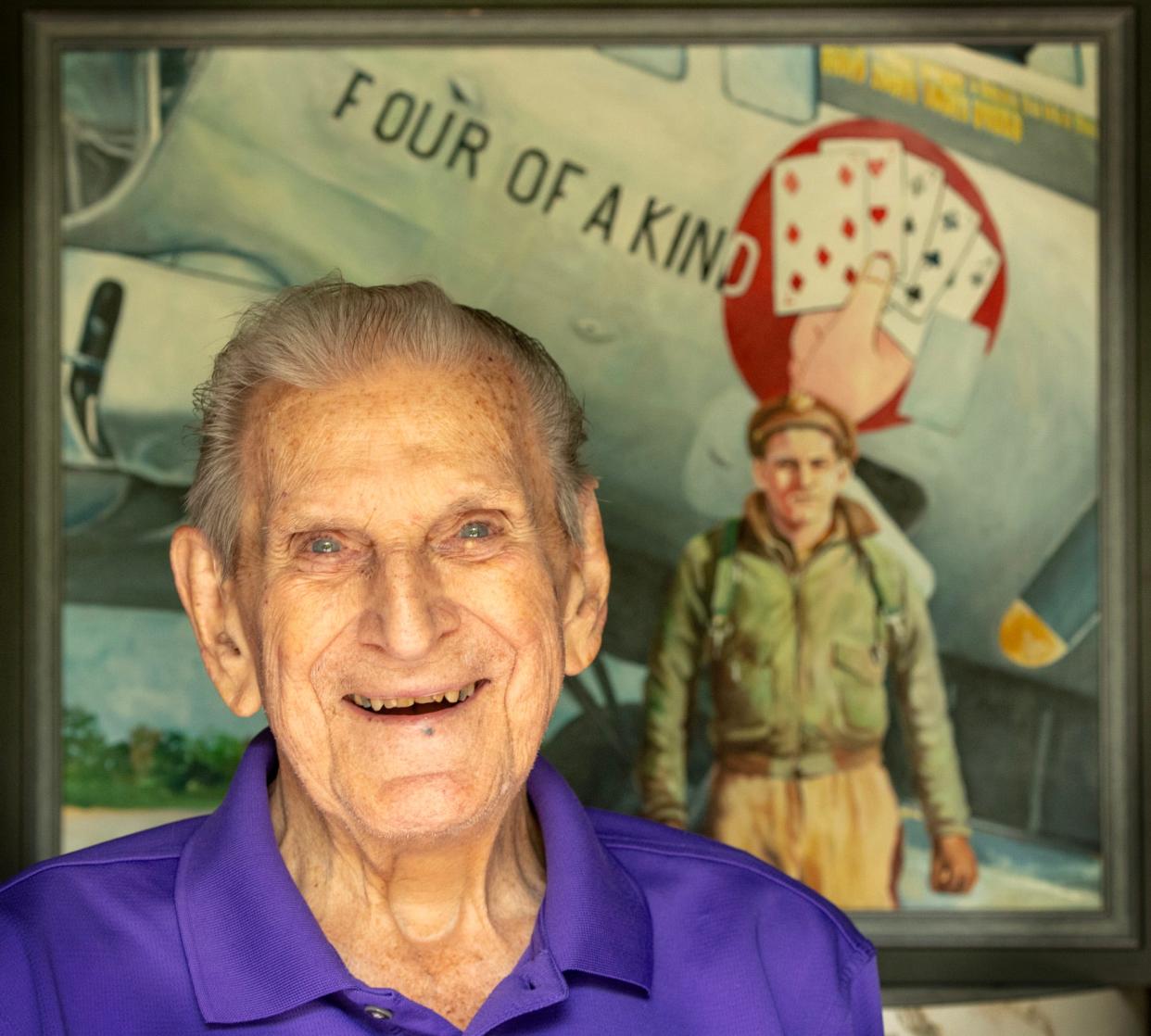 World War II pilot Vincent “Bill” J. Purple is photographed in his Petersham home Tuesday. Behind him is a painting based on a photograph of Purple with one of the B-17s he flew in the war. The 2013 painting is by artist Chris Demarest.