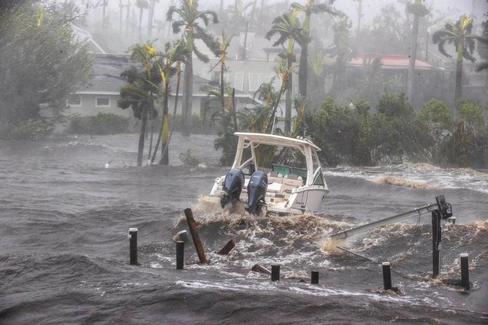 A boat is seen from the Midpoint Bridge in the Caloosahatchee River in Fort Myers as Hurricane Ian hits the west coast of Florida as a Category 4 storm on Wednesday, Sept. 28, 2022.