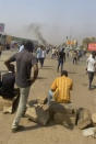 In this frame taken from video protesters block a street in Khartoum, Sudan, Monday, Oct. 25, 2021. Sudan’s leading general has dissolved the government and says the military will run the country until elections in 2023. His announcement came hours after his forces arrested the acting prime minister and other senior government officials. In a televised address Monday, Gen. Abdel-Fattah Burhan declared a state of emergency and dissolved the country's ruling Sovereign Council as well as the government. (AP Photo)