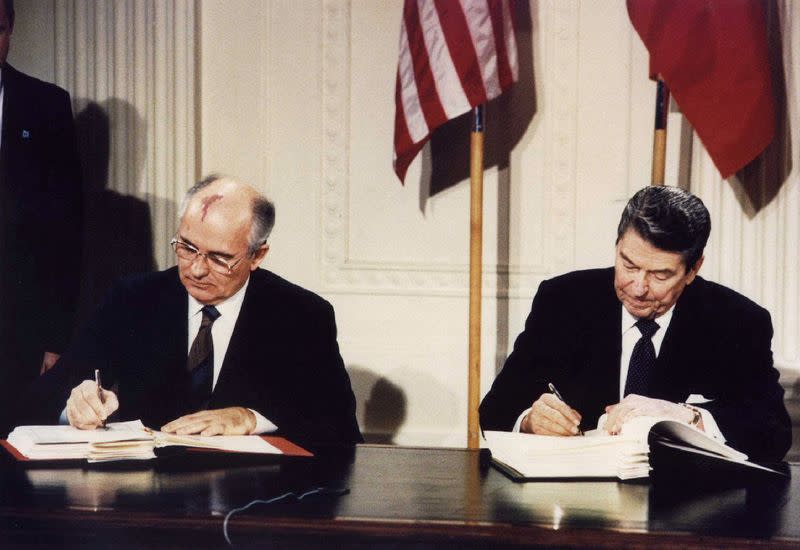 FILE PHOTO: Ronald Reagan and Mikhail Gorbachev sign the Intermediate-Range Nuclear Forces (INF) treaty in Washington