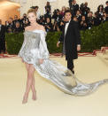 <p>Lili Reinhart looked stunning in a metallic minidress with a flwoing train as she posed alondside her Riverdale co-star and boyfriend Cole Sprouse. Photo: Getty Images </p>