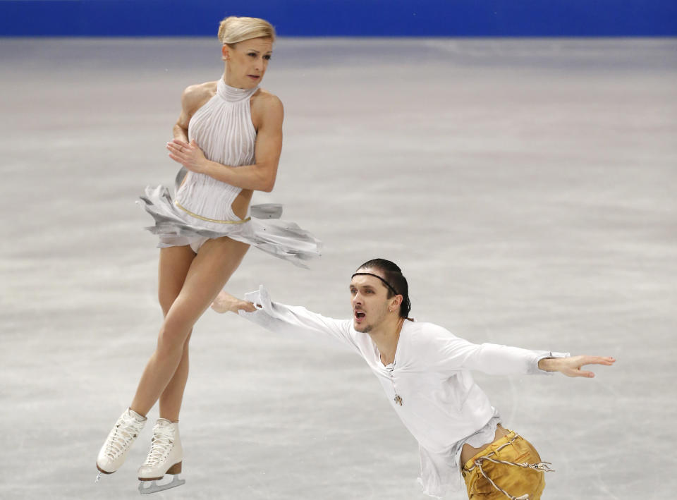 Russia's Tatiana Volosozhar and Maxim Trankov compete in the pairs free skating at the European Figure Skating Championships in Budapest, Hungary, Sunday, Jan. 19, 2014. (AP Photo/Darko Bandic)