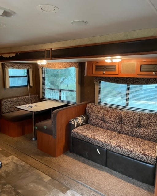 The 2014 camper before it was freshened up with several coats of paint, a new sofa and dining area.