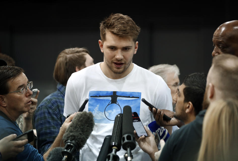 Dallas Mavericks' Luka Doncic responds to questions during an NBA basketball news conference in Dallas, Thursday, April 11, 2019. (AP Photo/Tony Gutierrez)