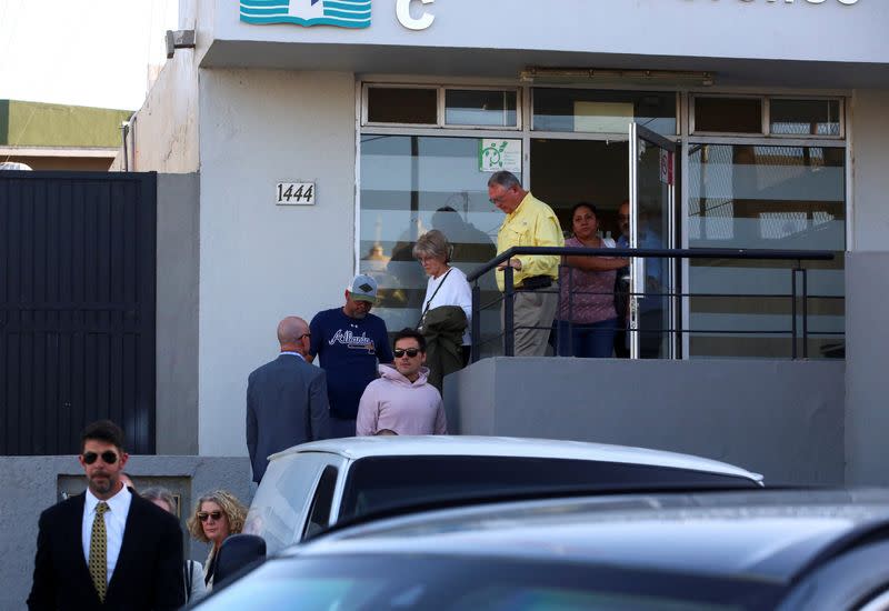 Members of the United States and Australian embassies and the parents of missing U.S. and Australian tourists leave the Forensic Medical Service in Ensenada