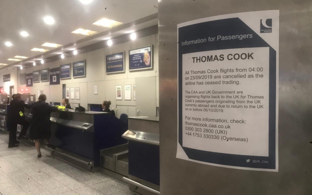 Flying nowhere: A sign at Bristol Airport tells early-morning customers of the collapse of Thomas Cook - Aled Llywelyn