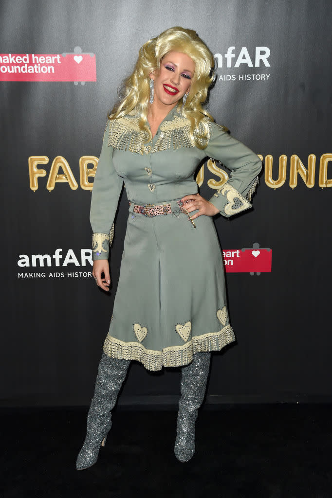 <p>The western dress, the big blonde hair, and the sparkly accessories? Obviously, the singer went as to a charity bash as country music icon Dolly Parton. (Photo: Nicholas Hunt/Getty Images) </p>