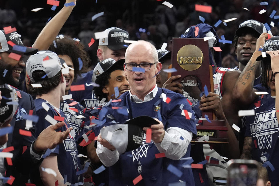 UConn head coach Dan Hurley catches confetti in his cap after defeating Illinois in the Elite 8 college basketball game in the men's NCAA Tournament, Saturday, March 30, 2024, in Boston. (AP Photo/Steven Senne)