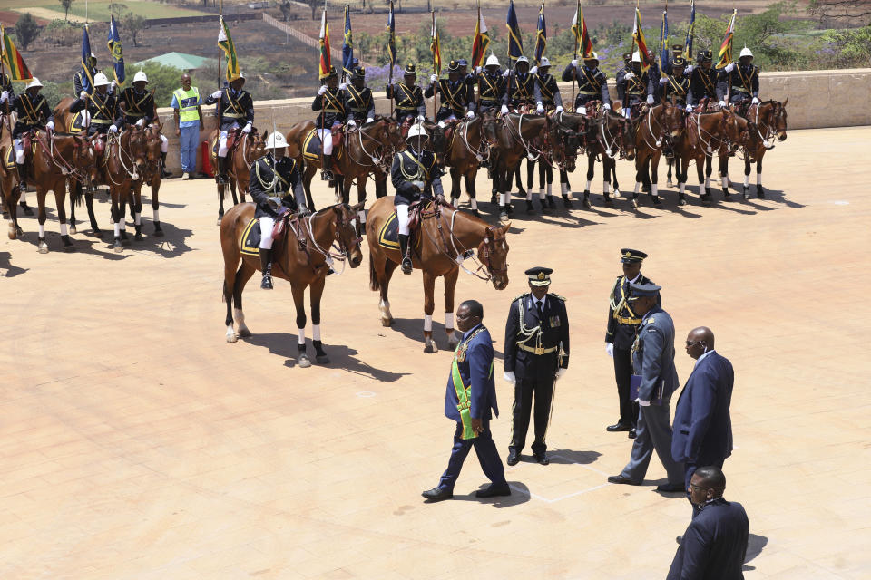 Zimbabwean President Emmerson Mnangagwa arrives for his State of the Nation address at the Parliament building on the outskirts of Harare, Tuesday, Oct 3, 2023. Zimbabwe's main opposition party boycotted Tuesdays first State of the Nation Address by Mnangagwa since disputed elections in August, another sign of the widening political cracks in the southern African nation as allegations of post-vote clampdown on government critics continue. (AP Photo/Tsvangirayi Mukwazhi)