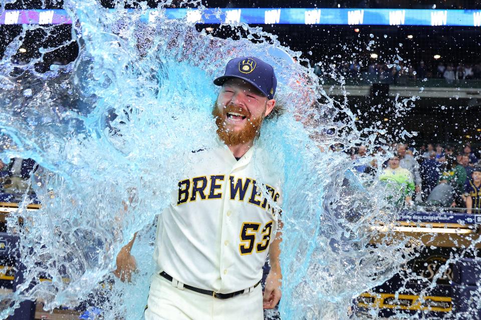 Brandon Woodruff of the Milwaukee Brewers is doused following a game against the Miami Marlins at American Family Field on September 11, 2023.