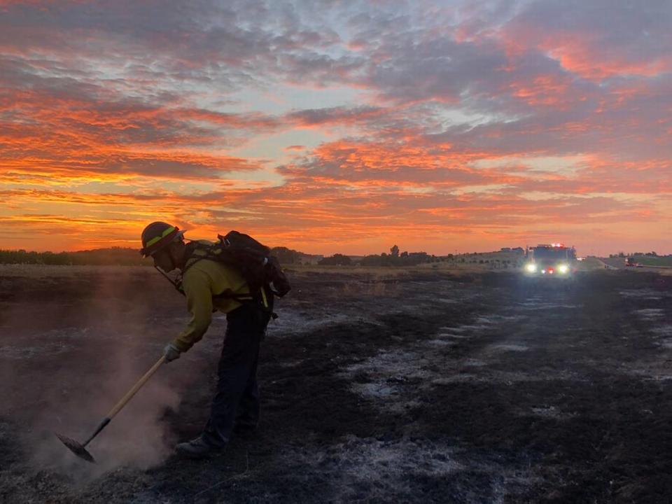 The Middleton Star Rural Fire department is unable to fully staff its two new fire stations in the district. A department firefighter helps put out a fire on farmland.