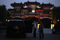 A man exits a U.S. embassy car outside the Tianjin Binhai No. 1 Hotel where U.S. and Chinese officials are expected to hold talks in Tianjin municipality in China on Sunday, July 25, 2021. Deputy Secretary of State Wendy Sherman travelled to China this weekend on a visit that comes as tensions between Washington and Beijing soar on multiple fronts, the State Department said Wednesday. (AP Photo/Ng Han Guan)