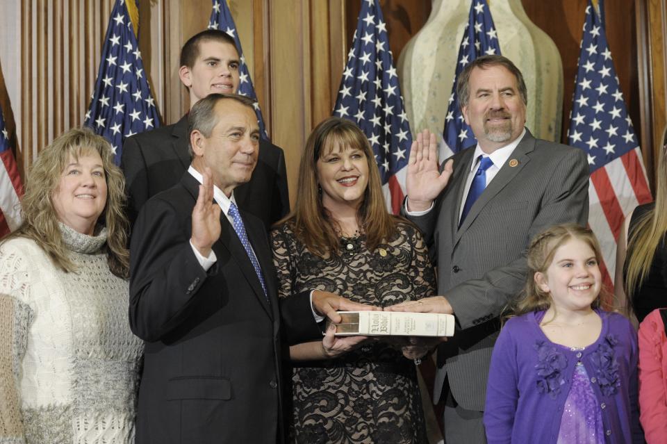 House Speaker John Boehner of Ohio, second from left, performs a mock swearing in for Rep. Doug LaMalfa, R-Calif., right, Thursday, Jan. 3, 2013, on Capitol Hill in Washington as the 113th Congress began. (AP Photo/Cliff Owen) 