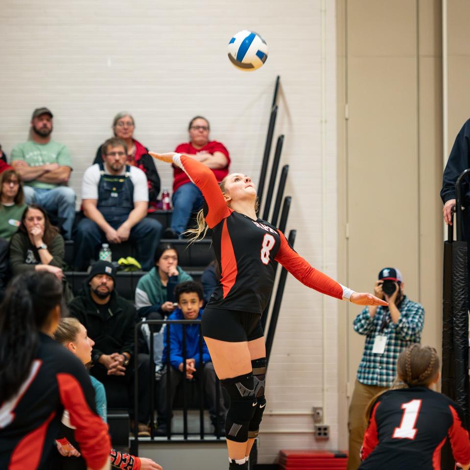 Elizabeth Hanba spikes the ball for Rome Free Academy during Wednesday's match against Camden at Strough Middle School in Rome.