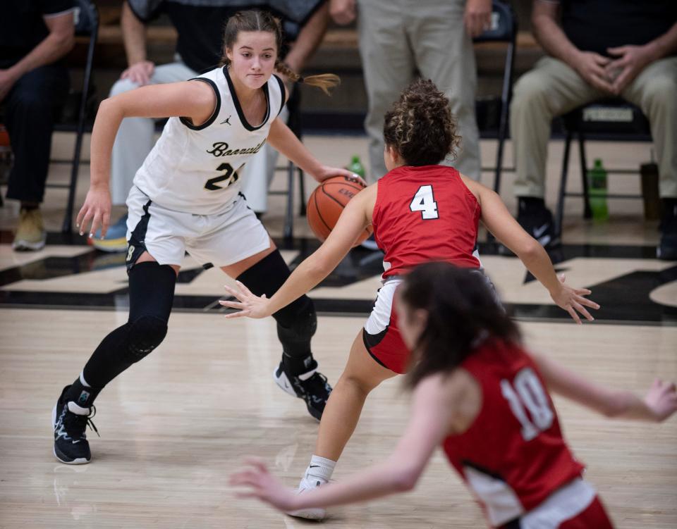 Boonville's Emily Parker (20) is defended by Princeton's Ailie Taylor (4) during their game at Boonville High School Thursday night, Dec. 8, 2022.