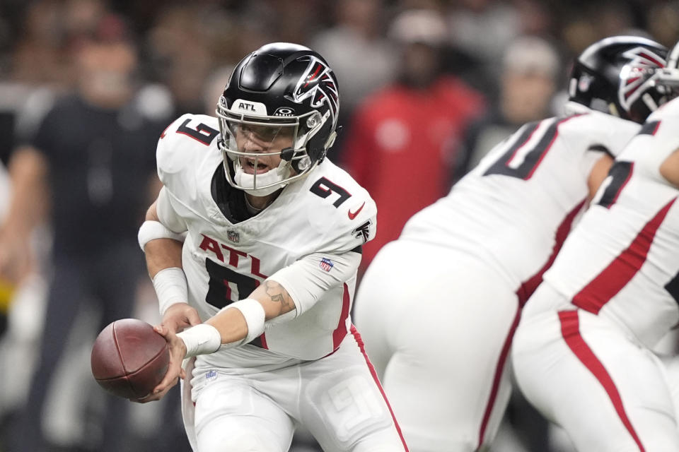 FILE - Atlanta Falcons quarterback Desmond Ridder (9) hands the ball off in the second half of an NFL football game against the New Orleans Saints in New Orleans, Sunday, Jan. 7, 2024. The Atlanta Falcons moved on from Desmond Ridder, trading their former starting quarterback to the Arizona Cardinals for receiver Rondale Moore on Thursday, March 14, 2024a person familiar with the deal told The Associated Press.(AP Photo/Gerald Herbert, File)