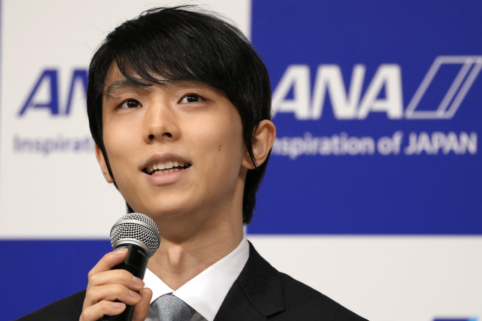 Two-time Olympic champion Yuzuru Hanyu of Japan, speaks during a press conference in Tokyo, Tuesday, July 19, 2022. Hanyu is stepping away from competitive figure skating, he said Tuesday. (AP Photo/Shuji Kajiyama)