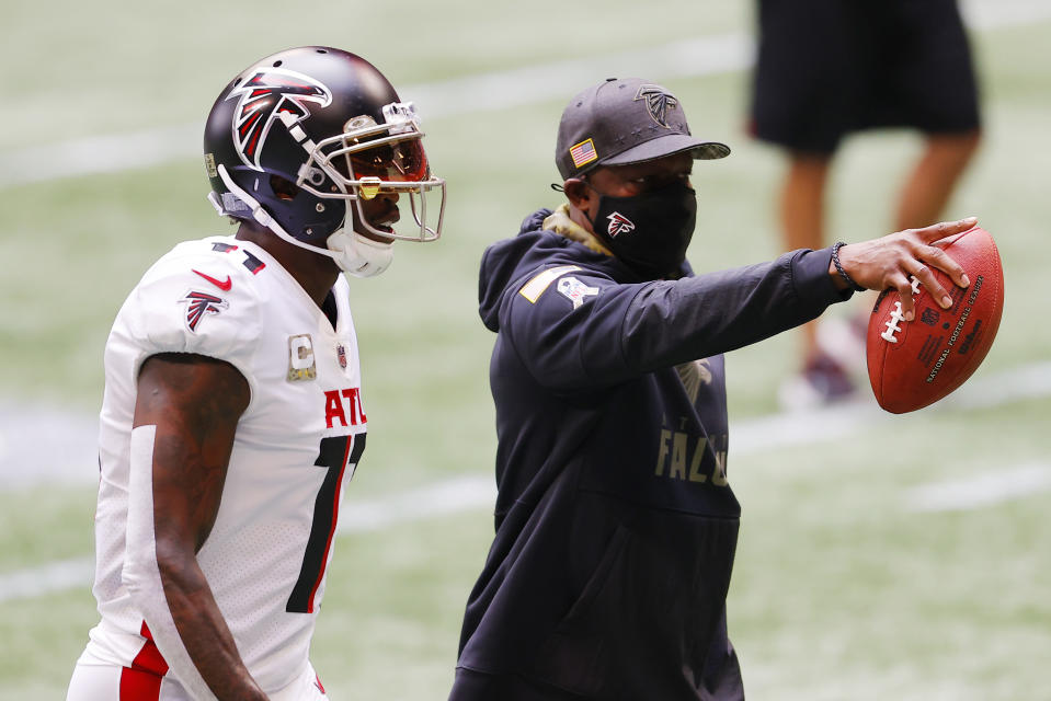 The Falcons' Raheem Morris, pictured with Julio Jones before a home game in November, is 4-5 as interim head coach. (Photo by Kevin C. Cox/Getty Images)
