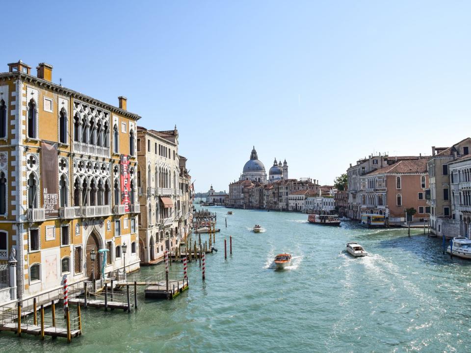 Boats going through Venice's canals in Italy.