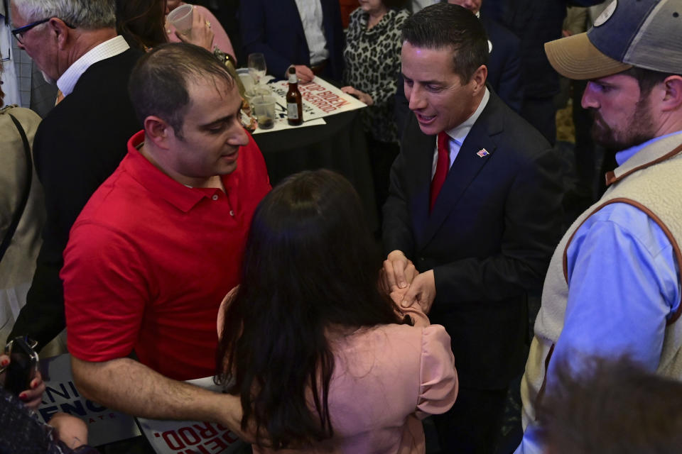 Cleveland businessman Bernie Moreno, a Republican candidate for U.S. Senate, shakes hands with a supporter during his primary election night watch party in Westlake, Ohio, Tuesday, March 19, 2024. (AP Photo/David Dermer)