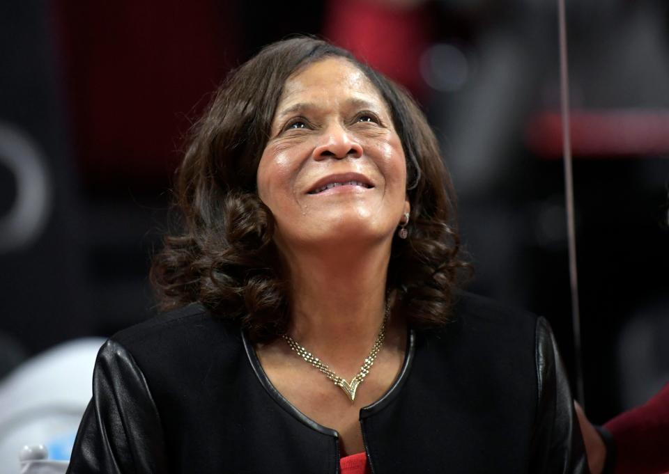 Rutgers head coach C. Vivian Stringer smiles as she watches the video screen after Rutgers defeated Central Connecticut for her 1,000th career NCAA college basketball game win, Tuesday, Nov. 13, 2018, in Piscataway, N.J.