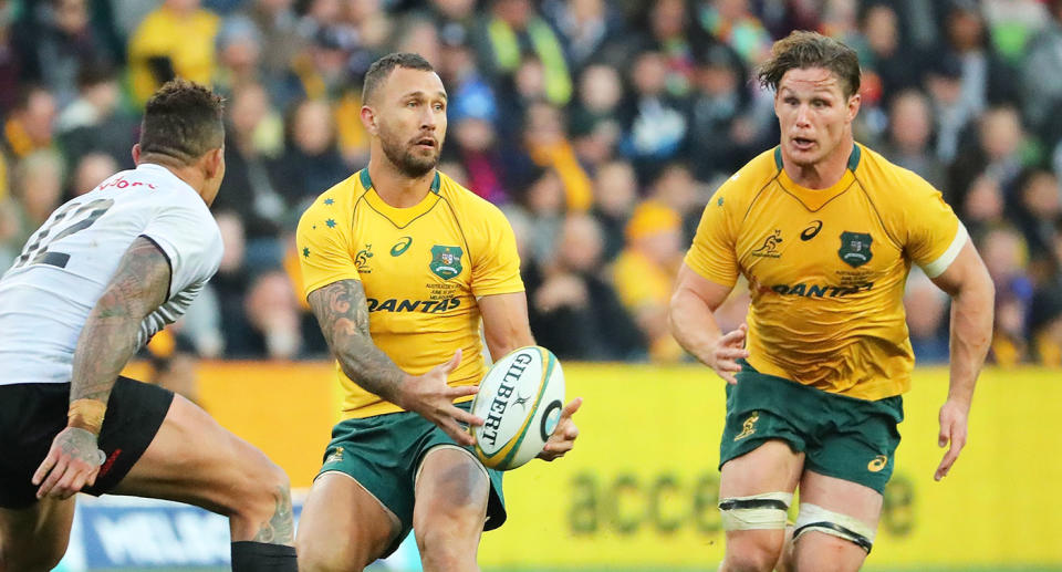 Seen left to right, former Wallabies stars Quade Cooper and Michael Hooper.