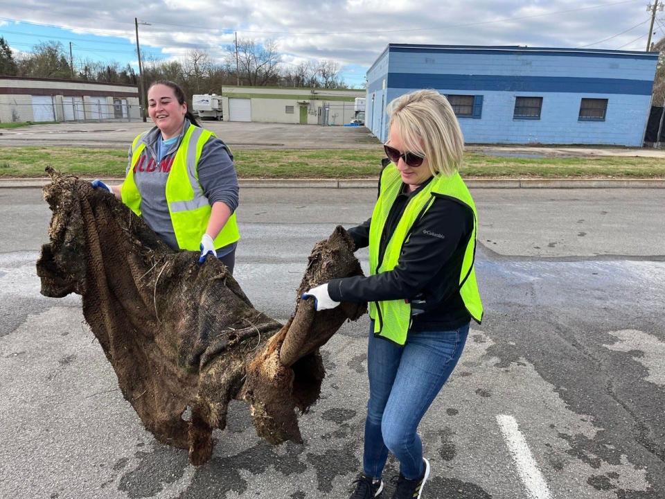 Volunteers remove trash and debris from outdoor spaces during a Keep Knoxville Beautiful event.