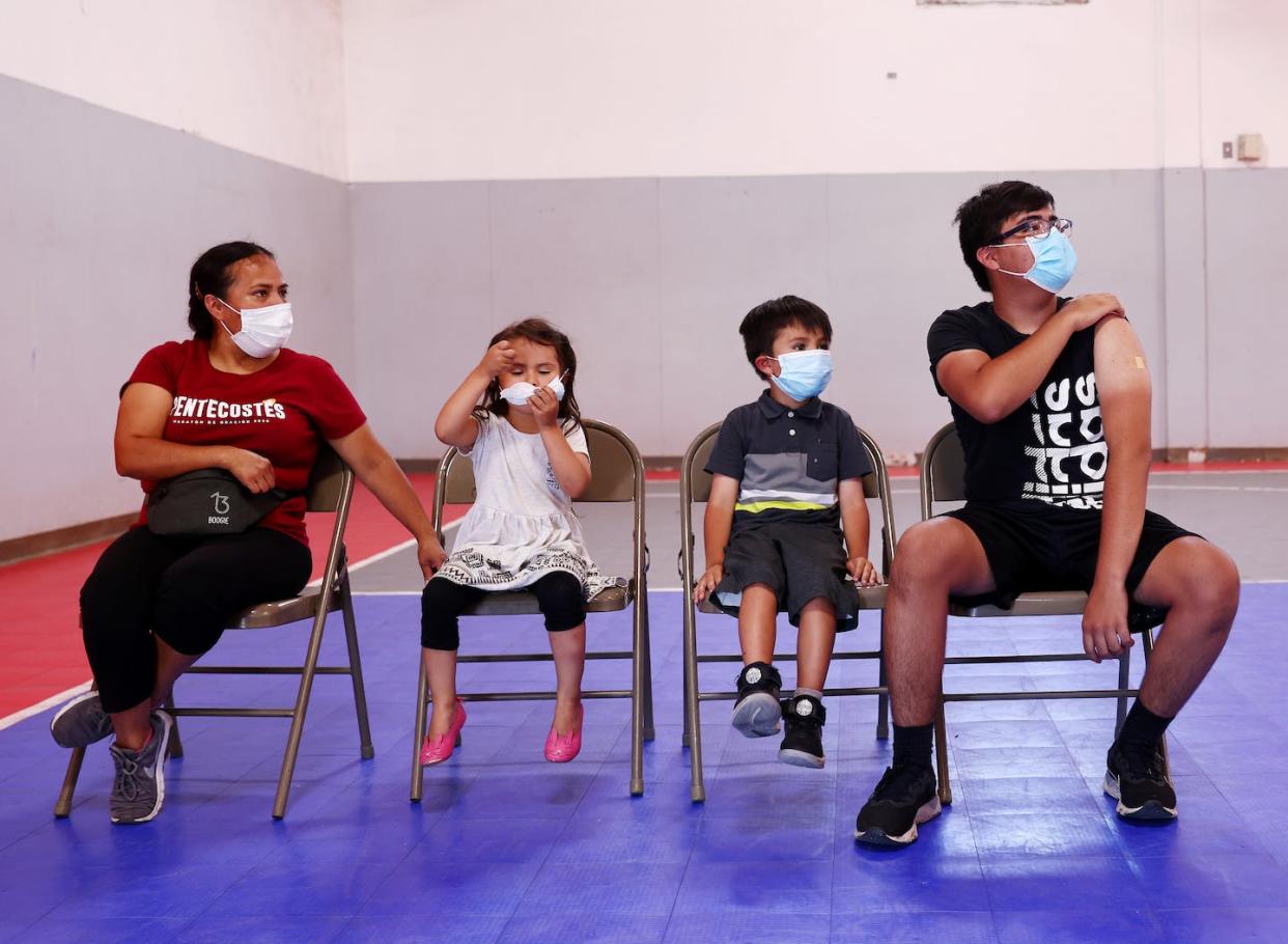 Many vaccine formulations are tweaked for patients of different ages. <a href="https://www.gettyimages.com/detail/news-photo/student-andy-melgar-checks-in-with-emt-alfonso-deza-after-news-photo/1327357664" rel="nofollow noopener" target="_blank" data-ylk="slk:Mario Tama via Getty Images;elm:context_link;itc:0;sec:content-canvas" class="link ">Mario Tama via Getty Images</a>