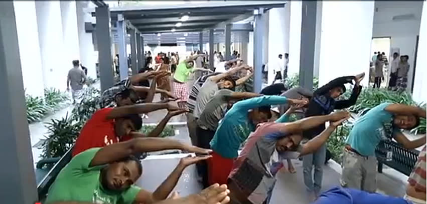 Free yoga lessons being taught in foreign worker dorm centres. (YouTube screengrab)