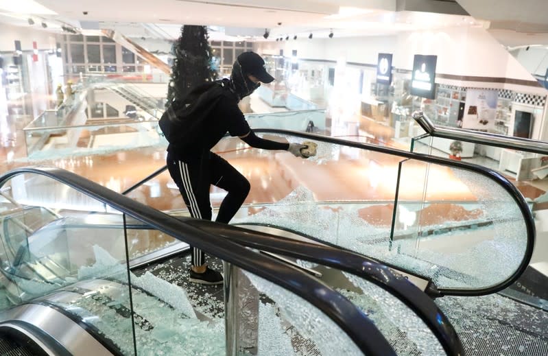 A protesters is seen at Festival Walk mall in Kowloon Tong, Hong Kong