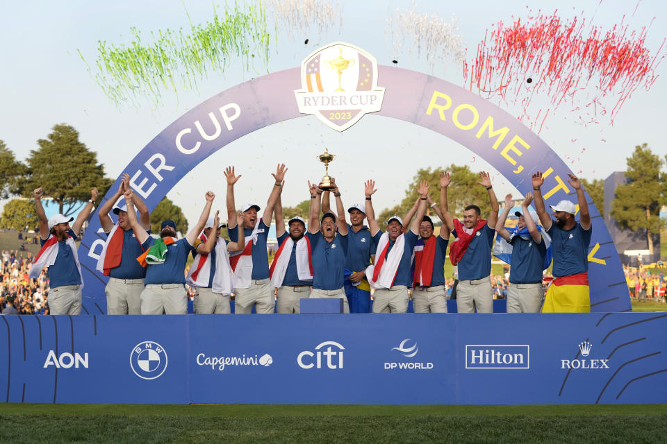The Europe team led by Europe's Team Captain Luke Donald, at centre lift the Ryder Cup after winning it at the Marco Simone Golf Club in Guidonia Montecelio, Italy, Sunday, Oct. 1, 2023. (AP Photo/Alessandra Tarantino)