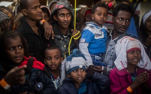 Migrants and refugees on board a Spanish rescue vessel, arriving in the port of Pozzallo in Sicily, January 2018. - Credit: AP