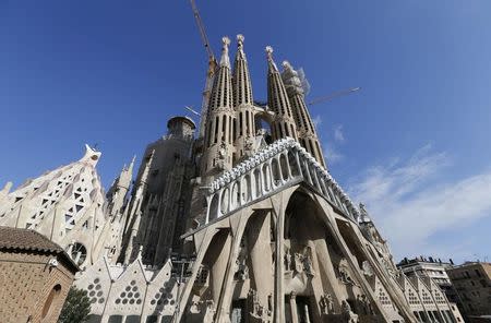 FILE PHOTO: Towers and construction cranes are seen as work continues on the Basilica Sagrada Familia, which was designed by Antoni Gaudi in Barcelona, Spain, December 30, 2016. REUTERS/Regis Duvignau