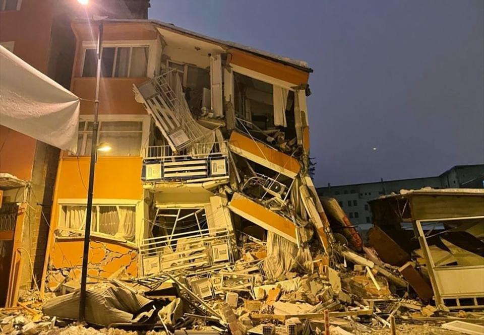 A collapsed building is seen following an earthquake in Pazarcik, in Kahramanmaras province, southern Turkey, early Monday.