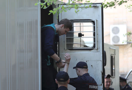 Russian soccer player Alexander Kokorin, who is charged with a brutal assault and held in custody, walks out of a truck before a court hearing in Moscow, Russia May 6, 2019. REUTERS/Evgenia Novozhenina