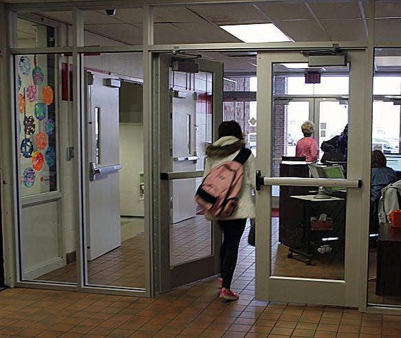 As part of a security upgrade, a glass wall partition was added to
the entrance at Fairfield Intermediate School to funnel visitors to
the office when entering or leaving the building.