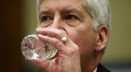 Michigan Governor Rick Snyder drinks some water as he testifies before a House Oversight and government Reform hearing on "Examining Federal Administration of the Safe Drinking Water Act in Flint, Michigan, Part III" on Capitol Hill in Washington March 17, 2016. REUTERS/Kevin Lamarque