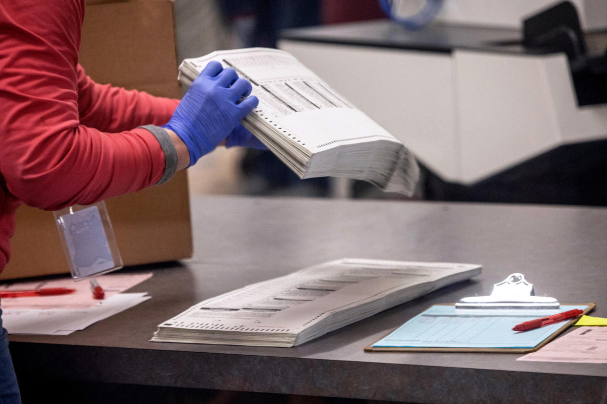 Election workers sort ballots at the Maricopa County Tabulation and Election Center in Phoenix (John Moore / Getty Images file)