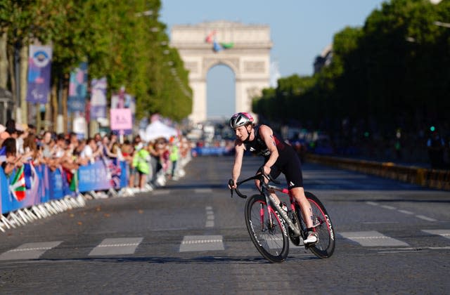 Great Britain’s Georgia Taylor-Brown rides in front of the Arc de Triomphe