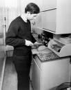 Prince Charles slices a loaf of bread in his student kitchen - perhaps beans on toast is fit for a king-to-be? Photo was taken in May 1969. (PA Images)