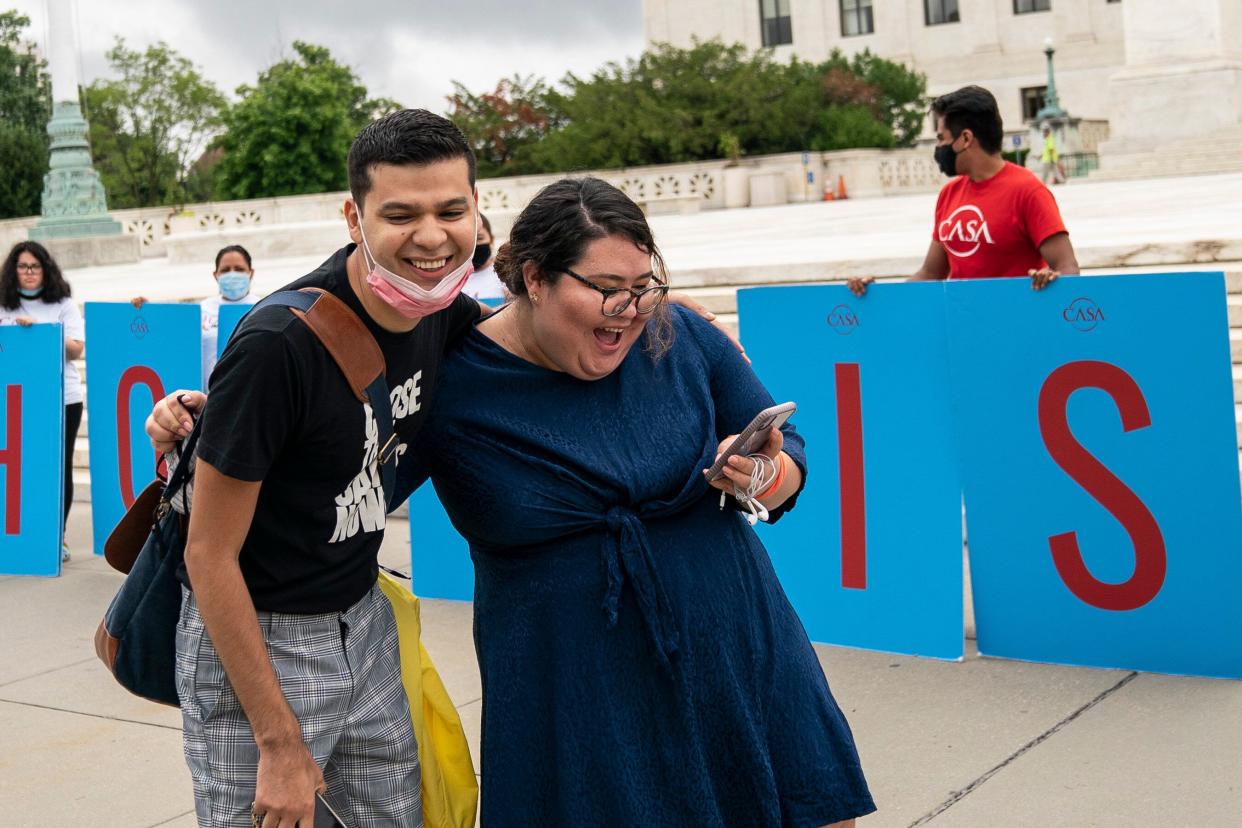 Greisa Martinez (R), who grew up as an undocumented immigrant in Dallas, Texas, reacts as she reads the Supreme Court's decision regarding the Trump administration's attempt to end DACA outside the U.S. Supreme Court on June 18, 2020, in Washington, D.C. (Photo: Drew Angerer via Getty Images)